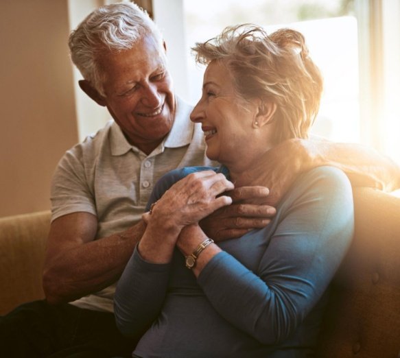 A senior couple sharing a warm moment at home